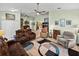 Spacious living room featuring a ceiling fan, a modern rug, and comfortable seating at 3686 Plymouth Dr, Winter Haven, FL 33884