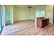 Large living room with wood floors that connects to the kitchen and has sliding glass doors at 3686 Plymouth Dr, Winter Haven, FL 33884