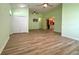 Spacious living room featuring wood floors, neutral paint, and ample natural light at 3686 Plymouth Dr, Winter Haven, FL 33884