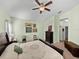 Spacious main bedroom with neutral carpet, a ceiling fan, and light-green colored walls at 3686 Plymouth Dr, Winter Haven, FL 33884