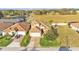 Well-maintained property features lush landscaping, tile roof, and a paved driveway at 369 Villa Sorrento Cir, Haines City, FL 33844