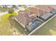 Backyard with pool, patio, and landscaping, perfect for outdoor living and entertaining at 369 Villa Sorrento Cir, Haines City, FL 33844