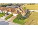 Well-maintained property features lush landscaping, tile roof, and a paved driveway at 369 Villa Sorrento Cir, Haines City, FL 33844