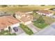 Well-maintained property features lush landscaping, tile roof, and a paved driveway at 369 Villa Sorrento Cir, Haines City, FL 33844