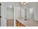 Bathroom featuring a vanity and a doorway leading to the adjacent room at 369 Villa Sorrento Cir, Haines City, FL 33844