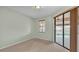 Carpeted bedroom has sliding glass door that leads out to a pool at 369 Villa Sorrento Cir, Haines City, FL 33844