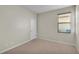 A bedroom featuring neutral walls, carpeted floors and a window at 369 Villa Sorrento Cir, Haines City, FL 33844