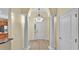 Elegant foyer with tile flooring, soaring ceilings, decorative columns, and a front door with sidelights at 369 Villa Sorrento Cir, Haines City, FL 33844