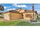 Charming home with a terracotta roof, brick driveway, and well-manicured landscaping around the exterior at 369 Villa Sorrento Cir, Haines City, FL 33844