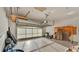Spacious garage featuring ample storage, high ceilings, a translucent garage door for natural light, and work space at 369 Villa Sorrento Cir, Haines City, FL 33844