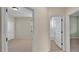 Hallway with views into multiple rooms, light walls and carpeted floors at 369 Villa Sorrento Cir, Haines City, FL 33844