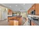 Bright open-concept kitchen featuring tile floors, pendant lighting, and stainless appliances at 369 Villa Sorrento Cir, Haines City, FL 33844