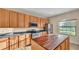 Well-lit kitchen featuring stainless steel appliances and an island at 369 Villa Sorrento Cir, Haines City, FL 33844