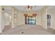 Spacious living room with ceiling fan and sliding glass doors to the pool area at 369 Villa Sorrento Cir, Haines City, FL 33844