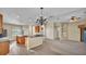 Open concept living space that flows from kitchen to dining to living room at 369 Villa Sorrento Cir, Haines City, FL 33844