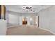 Spacious main bedroom with carpet flooring and ensuite bath with double door entries at 369 Villa Sorrento Cir, Haines City, FL 33844