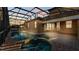 Relaxing outdoor living space features a screened pool with a connected hot tub at 369 Villa Sorrento Cir, Haines City, FL 33844