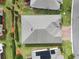 Aerial shot showcases the roof, well-maintained landscaping, and close proximity to neighbors in a suburban community at 3711 Plymouth Dr, Winter Haven, FL 33884