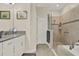 Bright bathroom featuring a walk-in shower, soaking tub, and a modern vanity with dual sinks at 3711 Plymouth Dr, Winter Haven, FL 33884