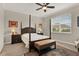 Comfortable bedroom with a four-poster bed, two nightstands, and soft neutral color palette at 3711 Plymouth Dr, Winter Haven, FL 33884