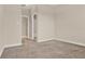 Neutral bedroom with carpet featuring a walk-in closet and an attached bathroom at 3711 Plymouth Dr, Winter Haven, FL 33884