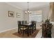 Inviting dining room with a dark wood table, seating for eight, and stylish decor at 3711 Plymouth Dr, Winter Haven, FL 33884