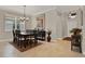 Elegant dining room with a large table, seating for eight, and stylish decor at 3711 Plymouth Dr, Winter Haven, FL 33884