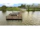 Community boat dock with 2 boats tied off at the end at 3711 Plymouth Dr, Winter Haven, FL 33884
