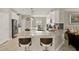 Modern kitchen featuring an island with bar seating, stainless steel appliances, and open design at 3711 Plymouth Dr, Winter Haven, FL 33884