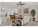 Inviting living room with an open layout, tile floors, and a view of the kitchen and dining area at 3711 Plymouth Dr, Winter Haven, FL 33884