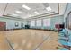 Well-lit multipurpose room with blue floor taping and rows of chairs at 3711 Plymouth Dr, Winter Haven, FL 33884
