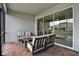 Cozy patio showcasing brick flooring, comfortable seating, and a seamless transition to the indoors through sliding glass doors at 3711 Plymouth Dr, Winter Haven, FL 33884
