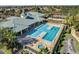 Aerial view of the community pool with a hot tub and tennis courts at 3711 Plymouth Dr, Winter Haven, FL 33884