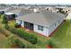 Aerial view of a house with a screened patio and landscaped backyard in a residential neighborhood at 3711 Plymouth Dr, Winter Haven, FL 33884