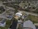 Aerial view of a single-Gathering home with a waterfront canal, pool, RV parking, and lush trees at 4024 Canal Rd, Lake Wales, FL 33898