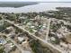 Aerial view of the lakefront community with lush trees, water access, and single-Gathering homes at 4024 Canal Rd, Lake Wales, FL 33898
