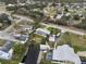 Aerial view of a single-Gathering home with a waterfront canal, pool, RV parking, and lush trees at 4024 Canal Rd, Lake Wales, FL 33898