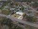 Aerial view of a single-Gathering home featuring a metal roof and a circle drive way at 4024 Canal Rd, Lake Wales, FL 33898