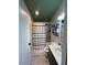 Bathroom with a black and white striped shower curtain, modern vanity and a green ceiling at 4024 Canal Rd, Lake Wales, FL 33898