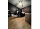 Bedroom with dark walls, modern ceiling fan and wood-look flooring for relaxing atmosphere at 4024 Canal Rd, Lake Wales, FL 33898