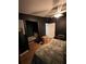 Dark bedroom features a unique nook with seating and hardwood floors at 4024 Canal Rd, Lake Wales, FL 33898