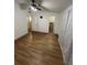 Bedroom featuring hardwood style floors, a ceiling fan, and multiple doorways at 4024 Canal Rd, Lake Wales, FL 33898