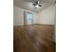 Bedroom featuring wood-look floors, a vaulted ceiling, and a bright window with natural light at 4024 Canal Rd, Lake Wales, FL 33898