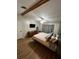 Bedroom features wood-look floors, ceiling fan, and tv at 4024 Canal Rd, Lake Wales, FL 33898