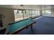 This game room features a pool table and large windows offering ample natural light at 4024 Canal Rd, Lake Wales, FL 33898