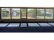 Bright game room with lots of windows overlooking the outdoors and navy blue carpet at 4024 Canal Rd, Lake Wales, FL 33898