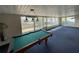 Spacious game room with a pool table, lots of windows for natural light, and a large blue carpet at 4024 Canal Rd, Lake Wales, FL 33898