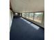 Bright game room with large windows, blue carpeting, offering a comfortable recreational space at 4024 Canal Rd, Lake Wales, FL 33898