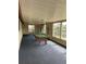 Sunlit game room features pool table, blue carpeting, and multiple windows with backyard views at 4024 Canal Rd, Lake Wales, FL 33898