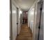Hallway leads to the laundry room, the living room, and the bathroom at 4024 Canal Rd, Lake Wales, FL 33898